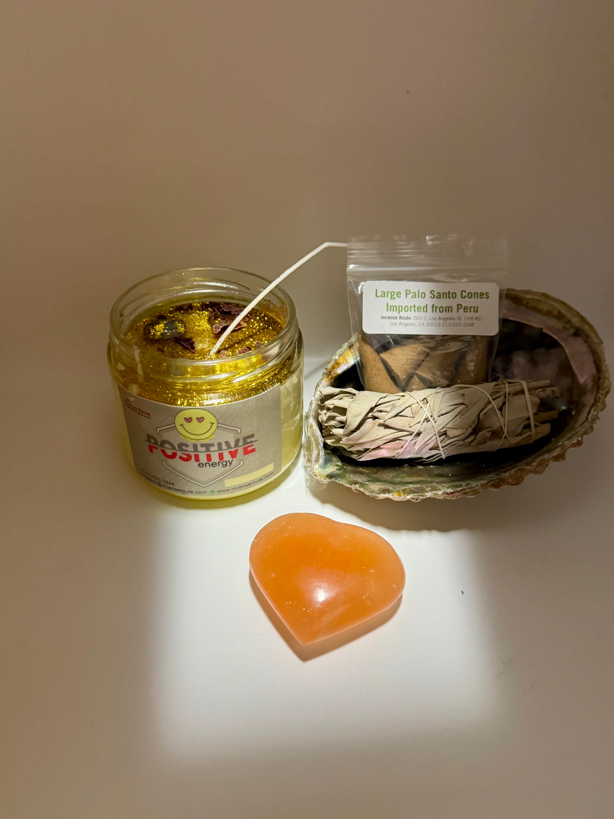 Housewarming Bundle with selenite heart, white sage, abalone shell, candle, Palo Santo cones, and charcoal - Incense Route