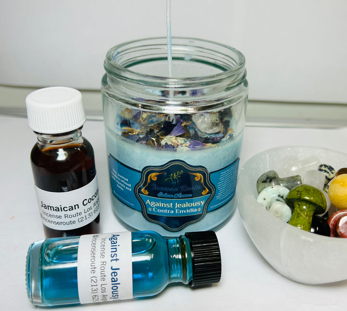 Handmade scented blue candle with herbs and crystals